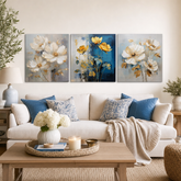 Set de 3 tablouri Poezia Florală Aurie de la Papilora – trei motive florale cu flori aurii pe pânză gallery-wrap, pe fundal alb.