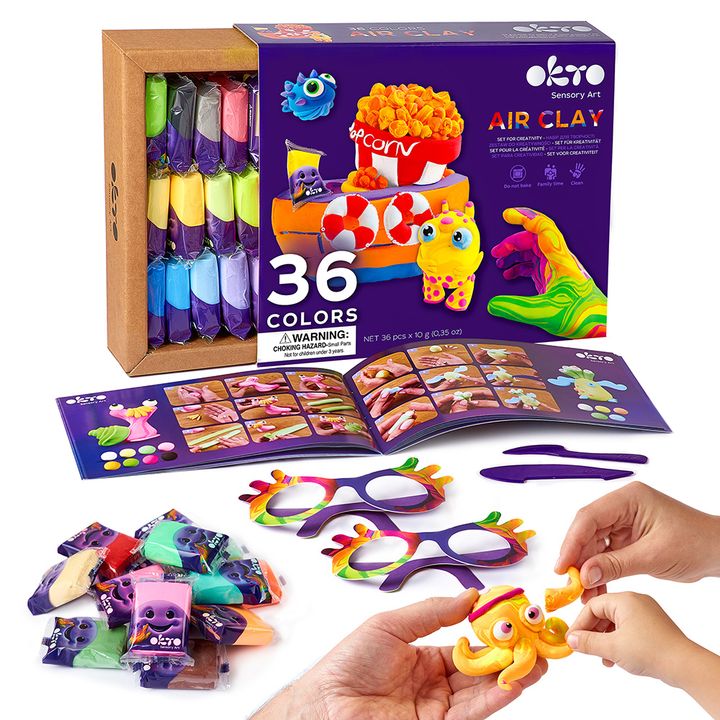 O vedere de aproape a setului de artă senzorială, evidențiind tuburile de plastilină cu fețe zâmbitoare, ochelarii colorați și pungile cu accesorii, Papilora.